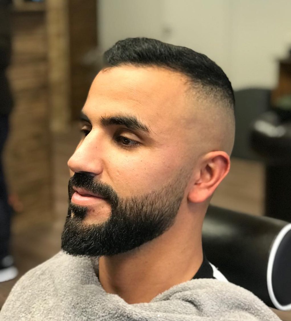 Hög skin fade med skägg
